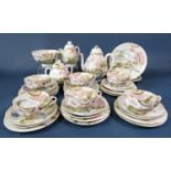 A collection of Japanese eggshell porcelain teawares including a covered teapot, covered sugar bowl,