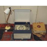 A vintage portable Fidelity radio record player together with a box containing a quantity of