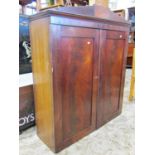 A 19th century mahogany side cupboard enclosed by a pair of well matched flame veneered