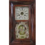 An American Ogee wall clock by the Forestville Clock Company, with eight day movement