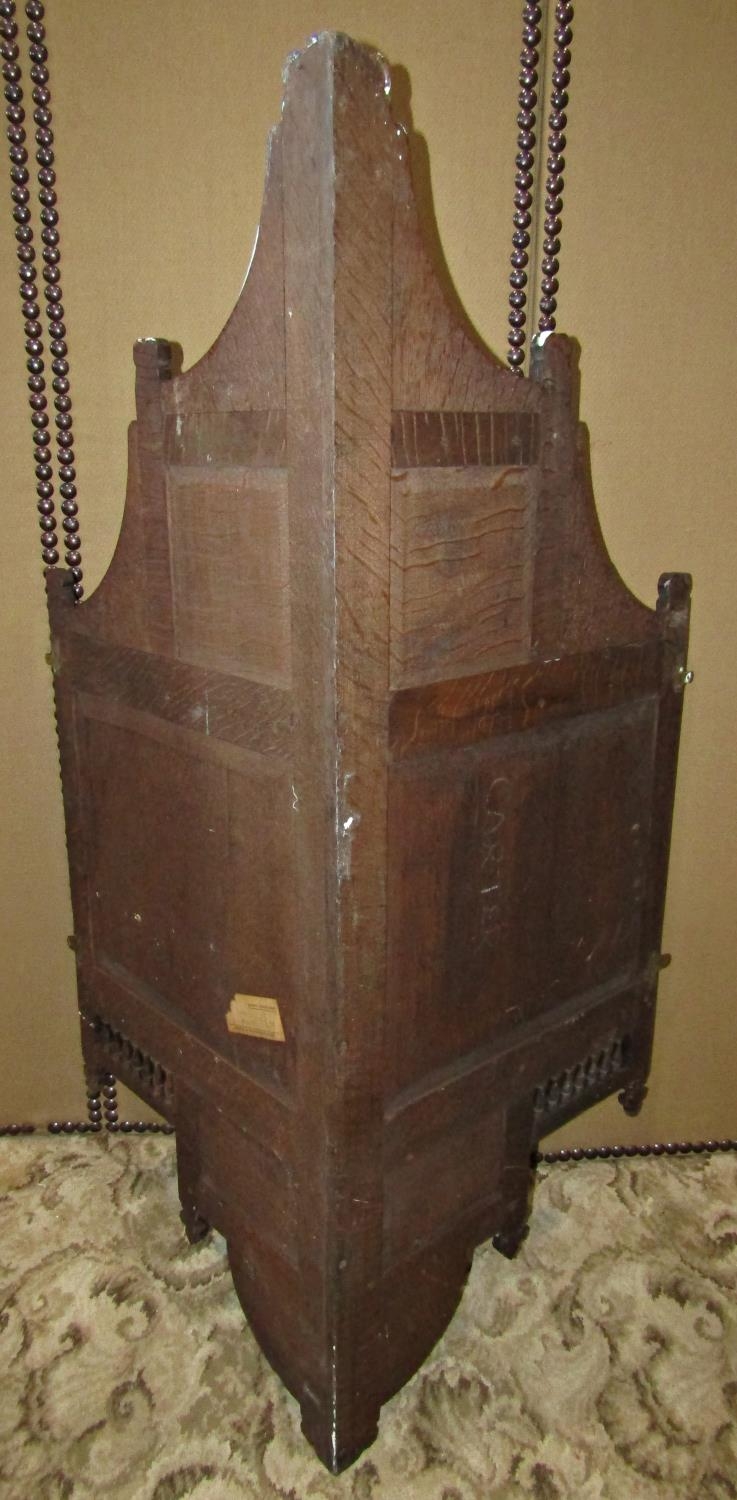 A late Victorian oak hanging corner cupboard, enclosed by a square panelled door with carved foliate - Image 3 of 5