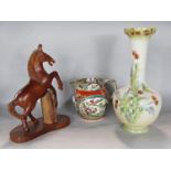 A floral long necked vase, a Victorian ironstone jug and carved wooden rearing horse (3)