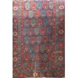 An antique Persian runner with rows of gull and stylised flowers, 260cm x 106cm