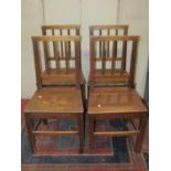 A set of four Georgian country made dining chairs with reeded stick backs over solid seats and