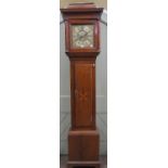 An 18th century oak longcase clock, the full length door with starburst detail, the hood with