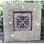 A weathered natural stone trough of square form with drainage hole, 46 cm square x 26 cm high,
