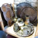 Three Zanzibar incised decorated copper trays, an Arabic coffee pot, a Mvuli wood thali tray, a