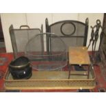 One lot of antique and later fireside ware/tools to include a pierced brass fender, two folding