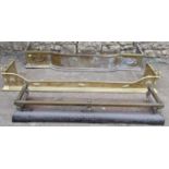 Two Edwardian brass fenders of varying size and design, both with applied neo classical detail,