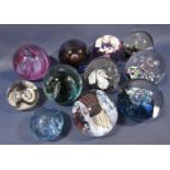 A collection of eleven Caithness paperweights. (No boxes)