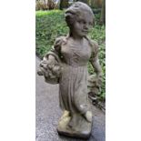 A weathered cast composition stone garden ornament in the form of a female figure clutching a basket