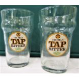 A large collection of branded drinking glasses, various sizes and styles to include beer/larger