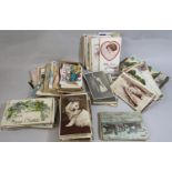An unsorted collection of Edwardian and later postcards, topographical greetings, humorous cards