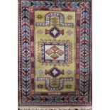 A modern design middle eastern rug with central medallion upon a yellow ground, 176cm x 83cm