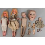 Collection of dolls for restoration including a miniature all bisque doll with period dress and