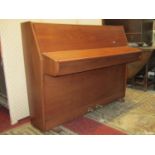 A Bentley upright iron framed and overstrung piano, stamped to casting J G X Z 3 E, British Made,