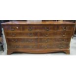 A reproduction Georgian style yew wood veneered dresser fitted with an arrangement of nine drawers