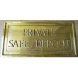 A heavy bronze panel - private safe deposit set within moulded bronze frame, 32 cm x 66 cm