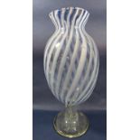 An Italian style Art glass vase with a pale blue and white spiral striped design raised on a clear