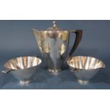 A Georg Jensen tea service comprising coffee pot, cream jug and sugar bowl, designed by Johan Rohde,