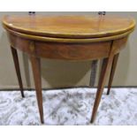 A Georgian mahogany demi lune foldover top tea table, with satinwood crossbanding, box wood string