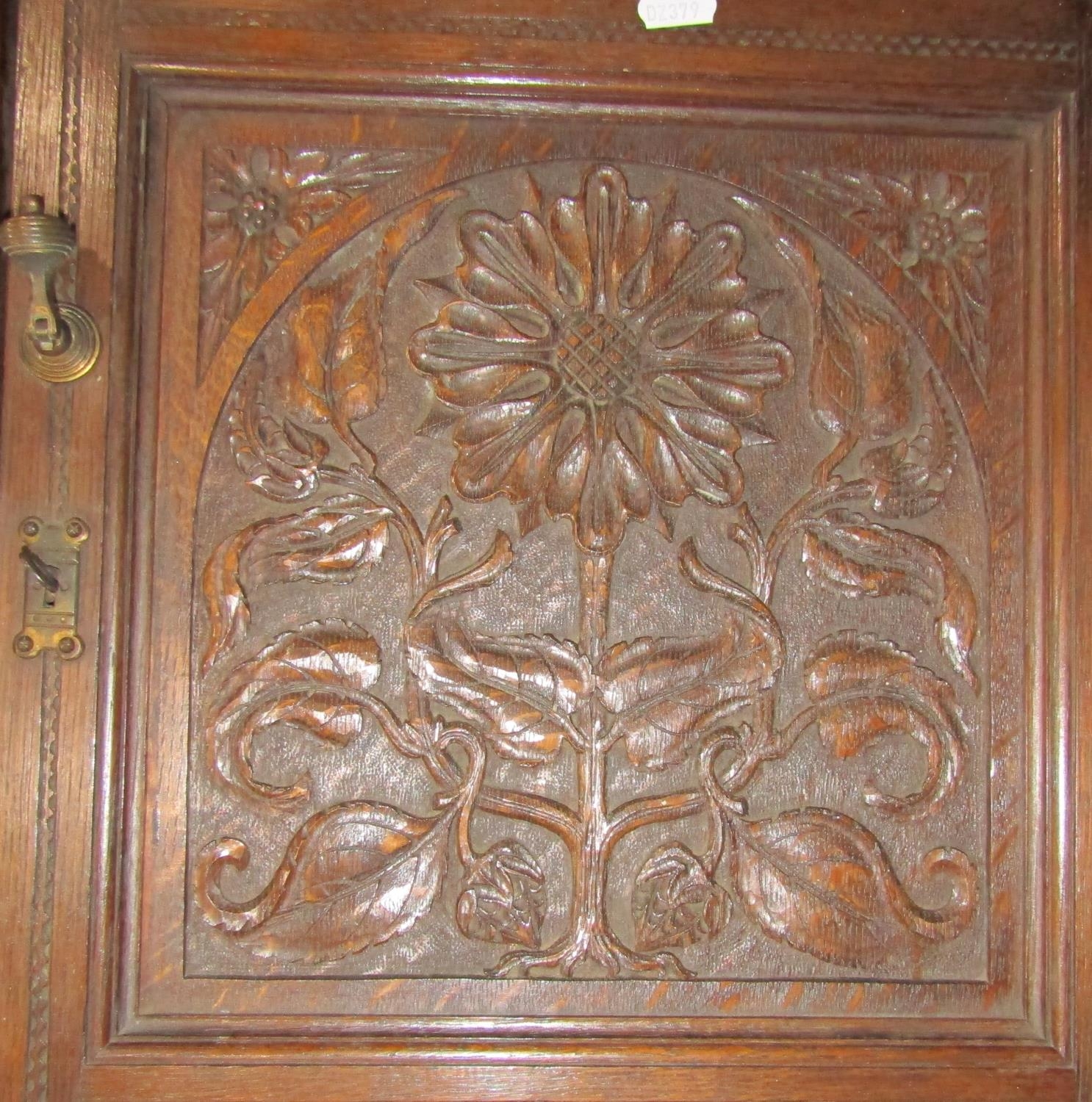 A late Victorian oak hanging corner cupboard, enclosed by a square panelled door with carved foliate - Image 4 of 5