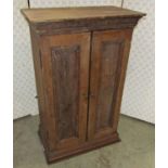 A vintage cigar cabinet, enclosed by a pair of slender rectangular panelled doors, with three