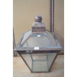 A traditional copper and glass hooded street lantern, square cut form, 40 cm x 60 cm in height