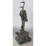 A Chines bronze of a pair of cranes on top a snake dragon turtle with calligraphy to the base. 23 cm