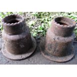 A pair of cast iron industrial moulds/components of tapered circular form possibly used/adapted