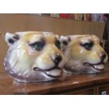 A pair of novelty glazed ceramic jardinières in the form of lions heads