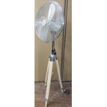 A retro chromium plated electric fan, the Icycool model number 247092, timber tripod base