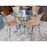 A contemporary iron framed five piece conservatory or patio suite comprising a circular table with