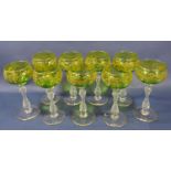 Nine Italianate Hock glasses with green bowls with gilt scrolled decoration. 17cm high.