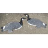 A pair of fret carved painted plywood Canada Geese decoys