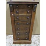 A Victorian walnut veneered Wellington chest of seven long graduated drawers with single strip