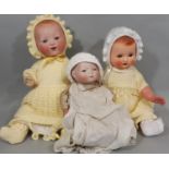 3 antique bisque head dolls including a 1920's soft bodied 'Bye-lo Baby' sitting cross legged height