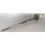 A 19th century, short ceremonial sword with a bone handle and brass hilt with a engraved three sided