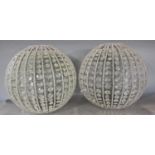 A pair of spherical beaded 'glass' light shades. 36cm diam.