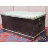 A 19th century stained pine and painted box with hinged lid and iron work drop side carrying