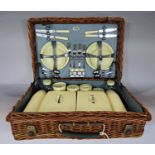 A 1950's Sirram picnic basket with a complete compliment of plates, beakers knives, forks etc (