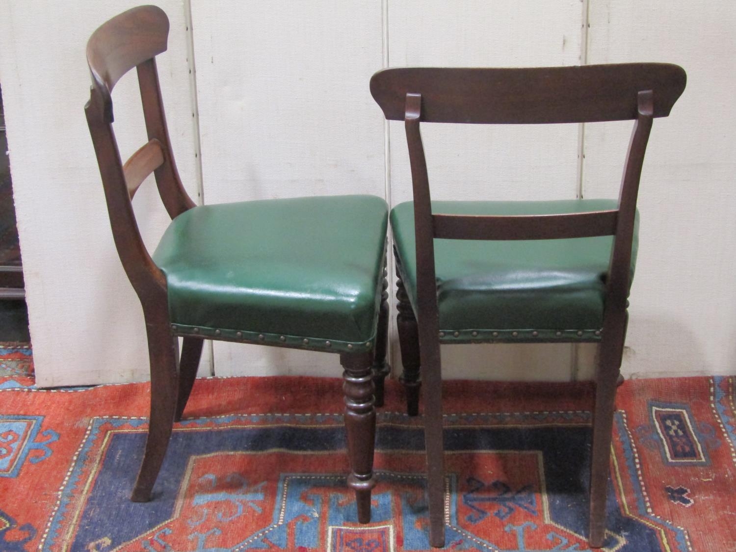 A set of six 19th century mahogany dining chairs with shaped bar backs over later green leather - Image 2 of 2