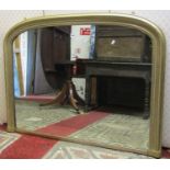 An arched and gilded overmantle mirror with Greek Key decoration and later painted finish, 90cm high