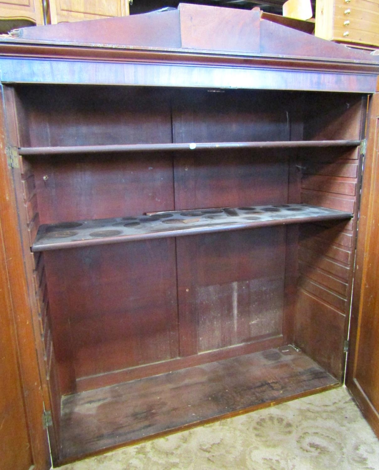 A 19th century mahogany side cupboard enclosed by a pair of well matched flame veneered - Image 2 of 3
