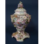 19th century continental vase and cover with encrusted and painted floral decoration and applied