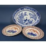 19th century oriental dish of oval form with painted blue and white exotic bird and flowering tree