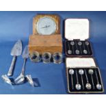 A cased set of six silver coffee spoons another set of silver plated coffee spoons, napkin rings,