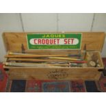 A pine Jacques croquet box and contents to include various mallets, balls and hoops