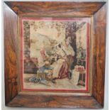 A 19th century needlework picture of figures in an arbour, 28 x 26.5cm approx, in rosewood frame
