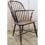 A 19th century Windsor low hoop and stick back elbow chair, principally in elm and ash
